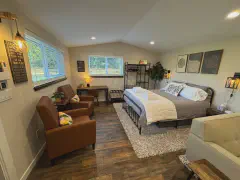 Spacious bedroom with queen bed and sitting area